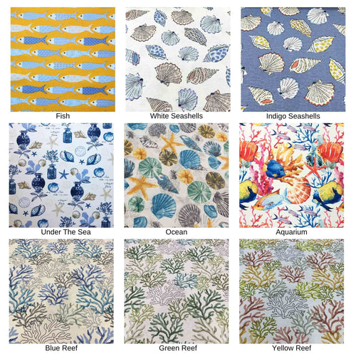 Nautical coastal fabric for upholstery & curtain printed in fish, sea shell, coral reef patterns in blue, white, yellow, green and red.