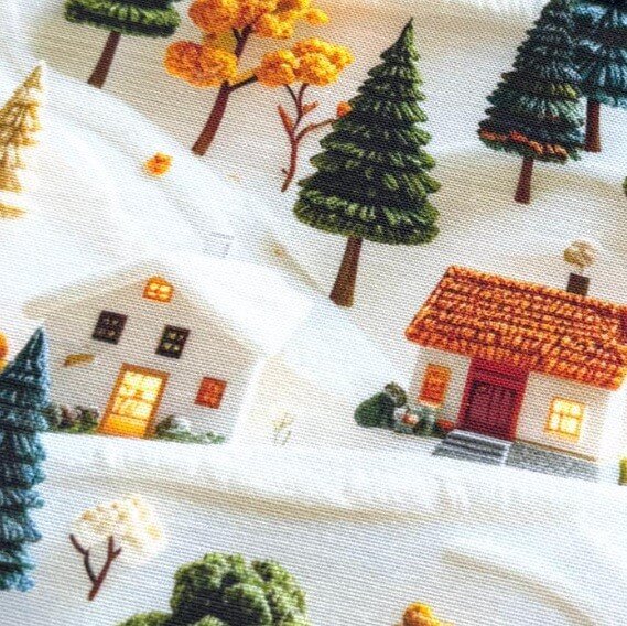 Upholstery fabric with 3d effect embroidered houses and trees pattern.