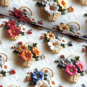 3d look upholstery curtain fabric patterned with embroidered flowers and baskets on a white background.