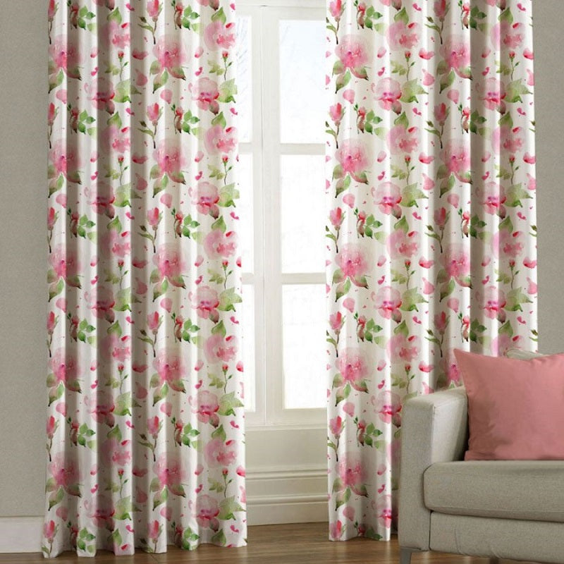 gray upholstery fabric covered sofa  with pink cushion and pink roses patterned curtain fabric