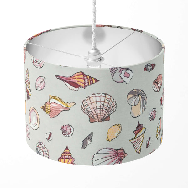 Silver grey lampshade patterned with blush pink sea shells.