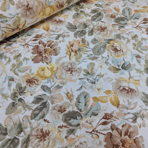 Pastel english rose patterned upholstery fabric featuring yellow, light brown flowers and sage green leaves.