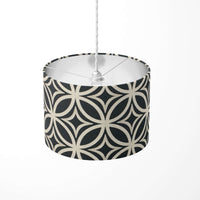 A black and beige art deco patterned ceiling lampshade on a white background.
