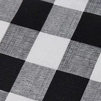 Close-up of a black and white check plaid print upholstery soft furnishing fabric