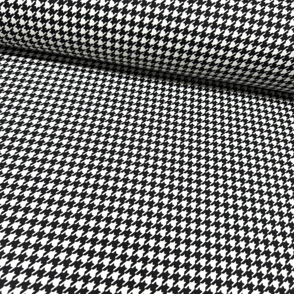 Black and white houndstooth dogtooth pattern fabric for upholstery curtain and home decor.