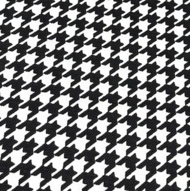 Houndstooth pattern cotton canvas fabric in black and white.