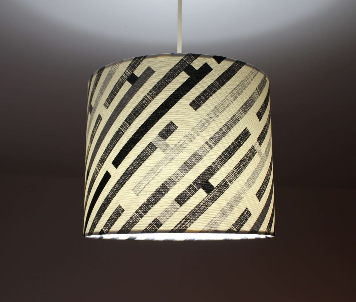 Abtract geometric lampshade in black, grey and white.