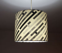 Abtract geometric lampshade in black, grey and white.
