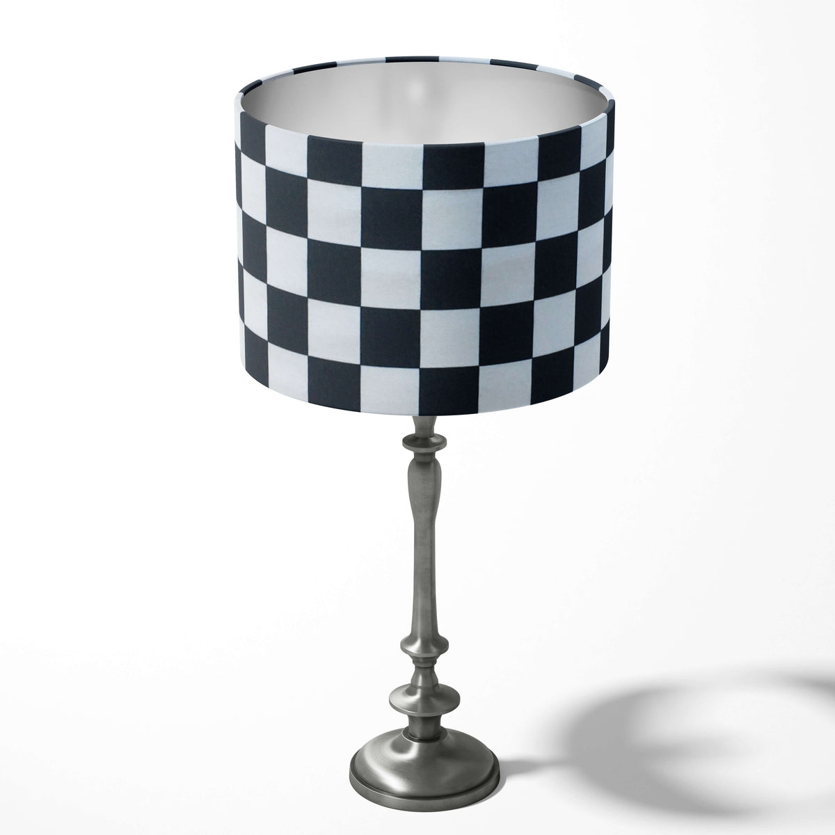 Geometric checkered black and white drum lampshade.