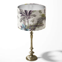Table lampshade with a tropical exotic palm trees pattern in green and blue on a white background.