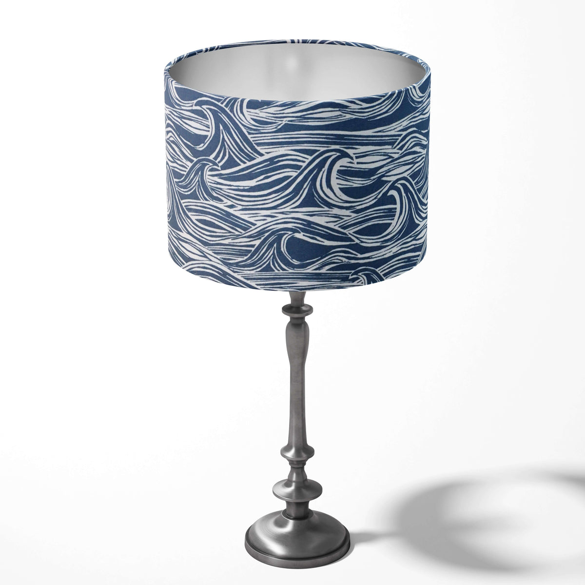 Table lampshade with a blue and white ocean pattern on a white background.