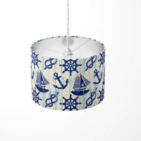 Blue and white pendant lampshade with a sailboat, sea, marine pattern on a white background.