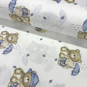 Cotton poplin fabric patterned with blue beige teddy bear, bunny and umbrella on a white background. 