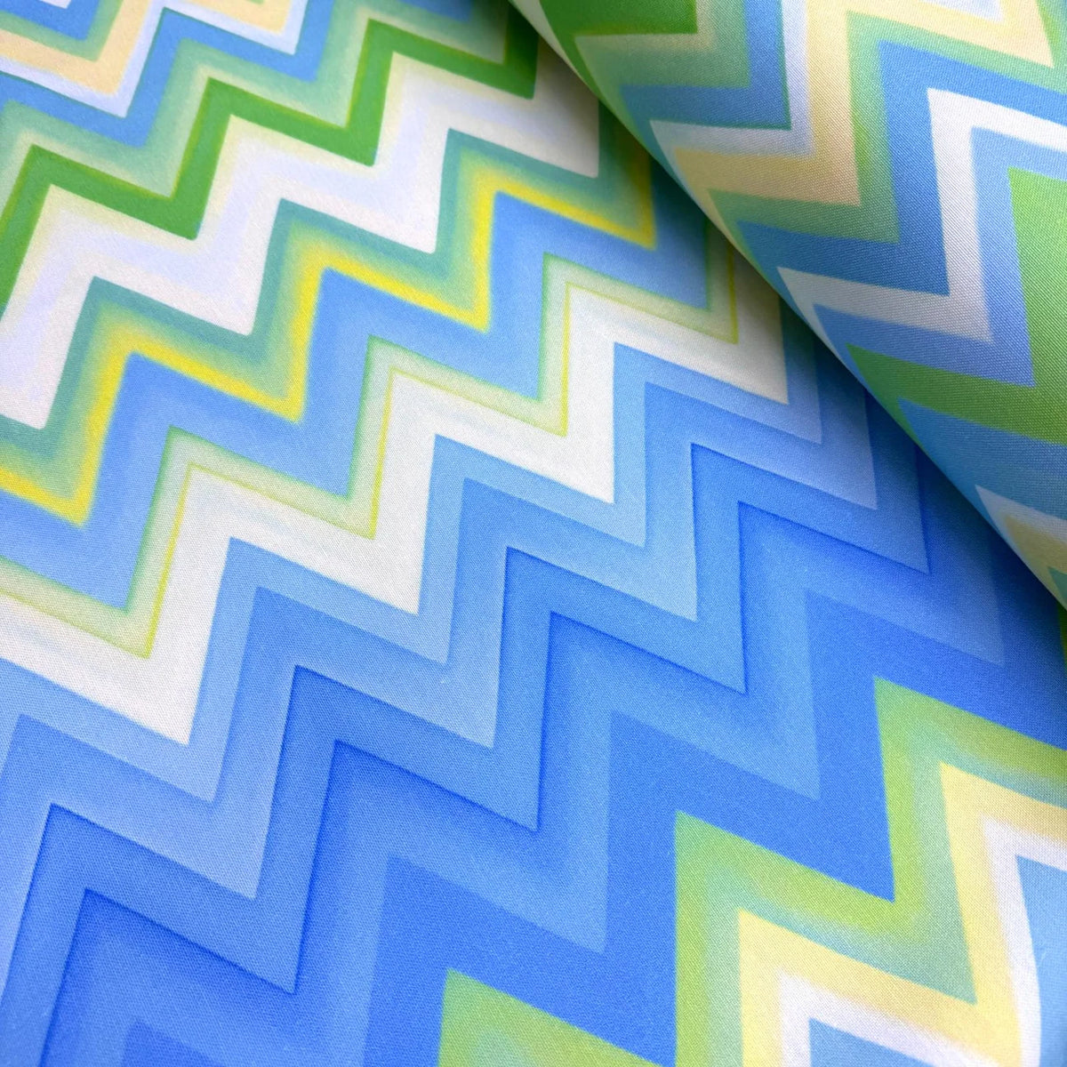 Chevron patterned fabric with blue, green, and white colors.