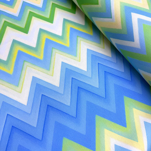 Chevron patterned fabric with blue, green, and white colors.