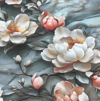 Close up of pink japanese flowers and blossoms patterned upholstery fabric on a grey marble background.