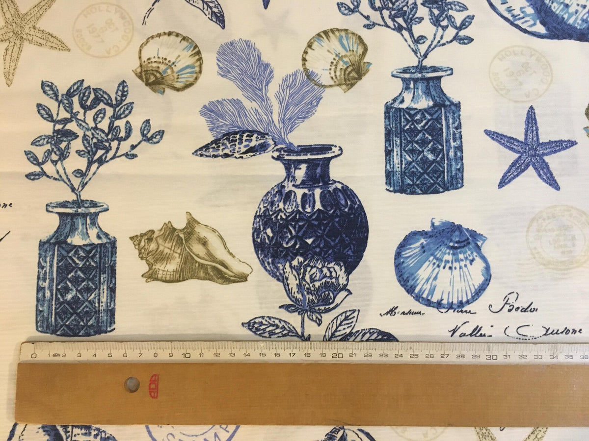 Nautical-themed fabric with blue vases, shells, and plants on a white background.