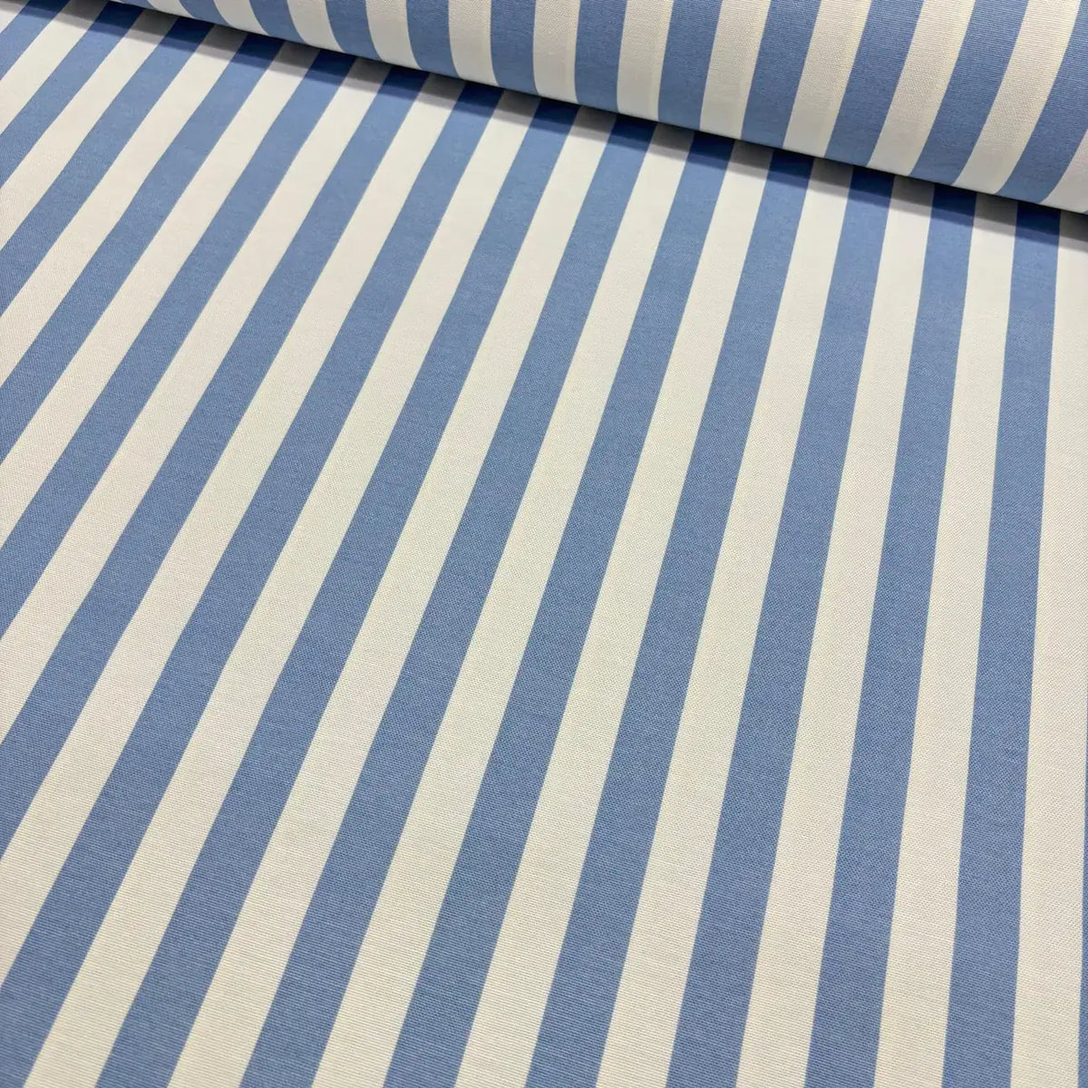 Light blue and white stripe patterned upholstery curtain fabric.