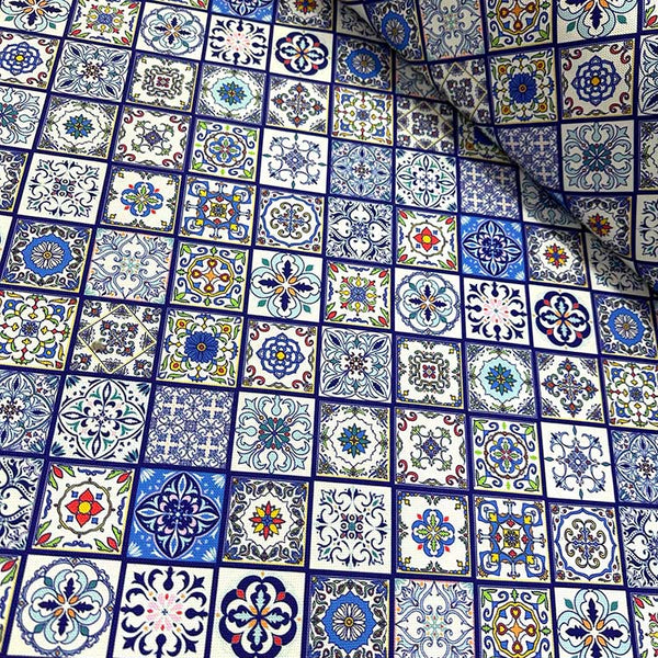 Spanish tile fabric patterned with floral blue and white mosaic for upholstery and curtain use.