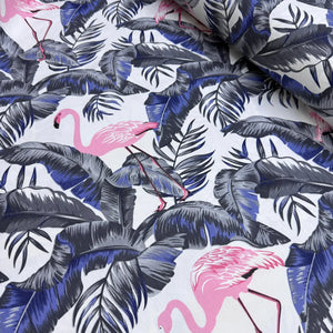 Upholstery fabric with pink flamingo and navy blue and grey leaves pattern.