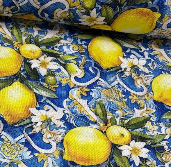 Fabric with a blue pattern featuring yellow lemons and white flowers.