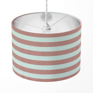 A blush pink horizontal striped lampshade designed for table lamps, floor lamps and ceiling pendants.