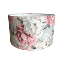 Boho pastel floral patterned lampshade with pink and white flowers on a gray background.