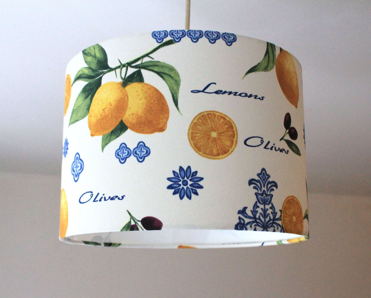 Lampshade with citrus lemon and olive design on a plain background.