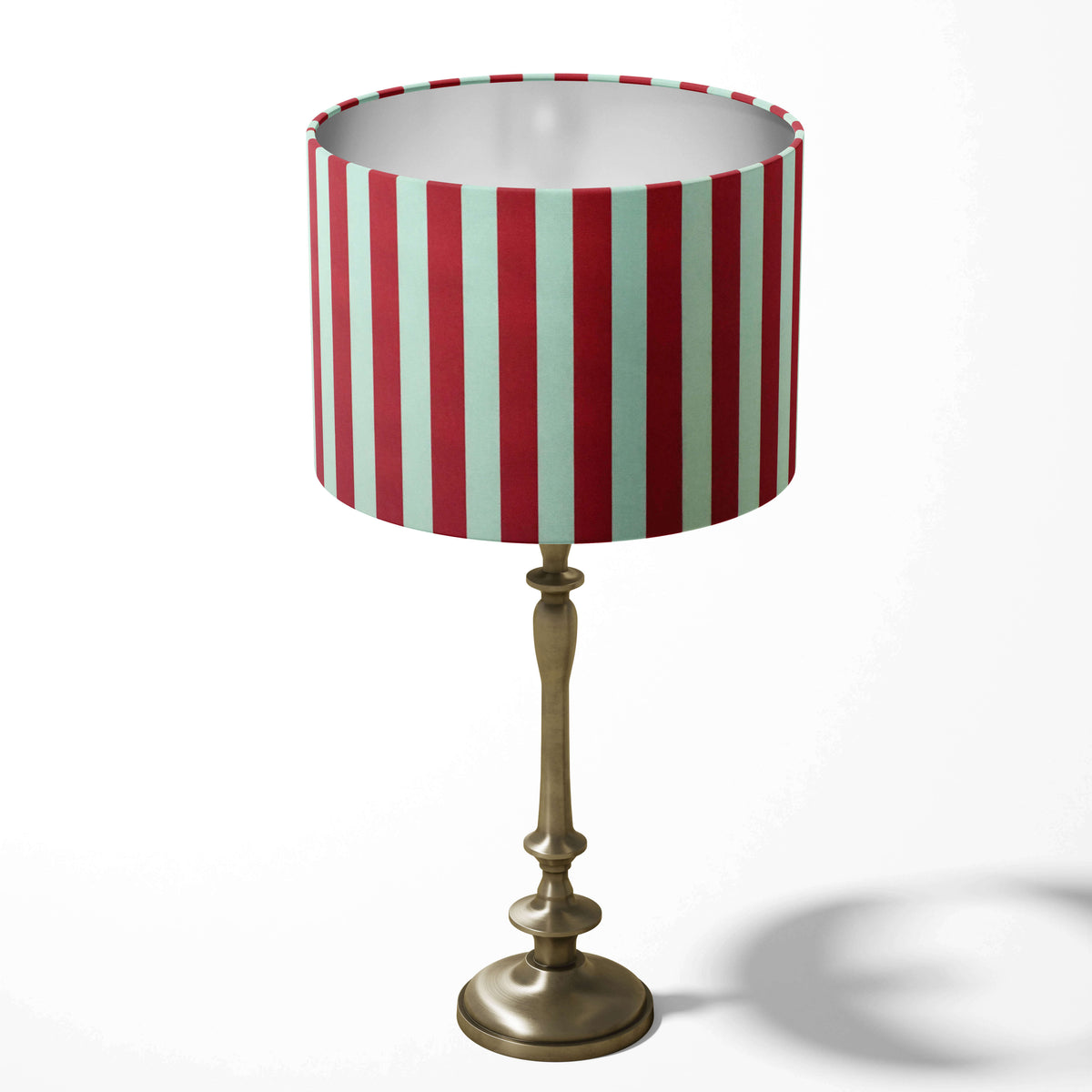 Geometric stripe table lampshade with red and white vertical stripes on a white background.