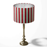 Geometric stripe table lampshade with red and white vertical stripes on a white background.