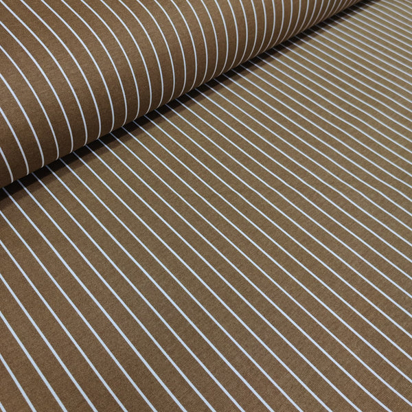 Brown cotton curtain fabric with white stripes, partially rolled up