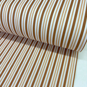 Caramel, brown and white striped cotton poplin fabric with modern multi-width stripes, ideal for dressmaking, quilting, patchwork and craft projects.