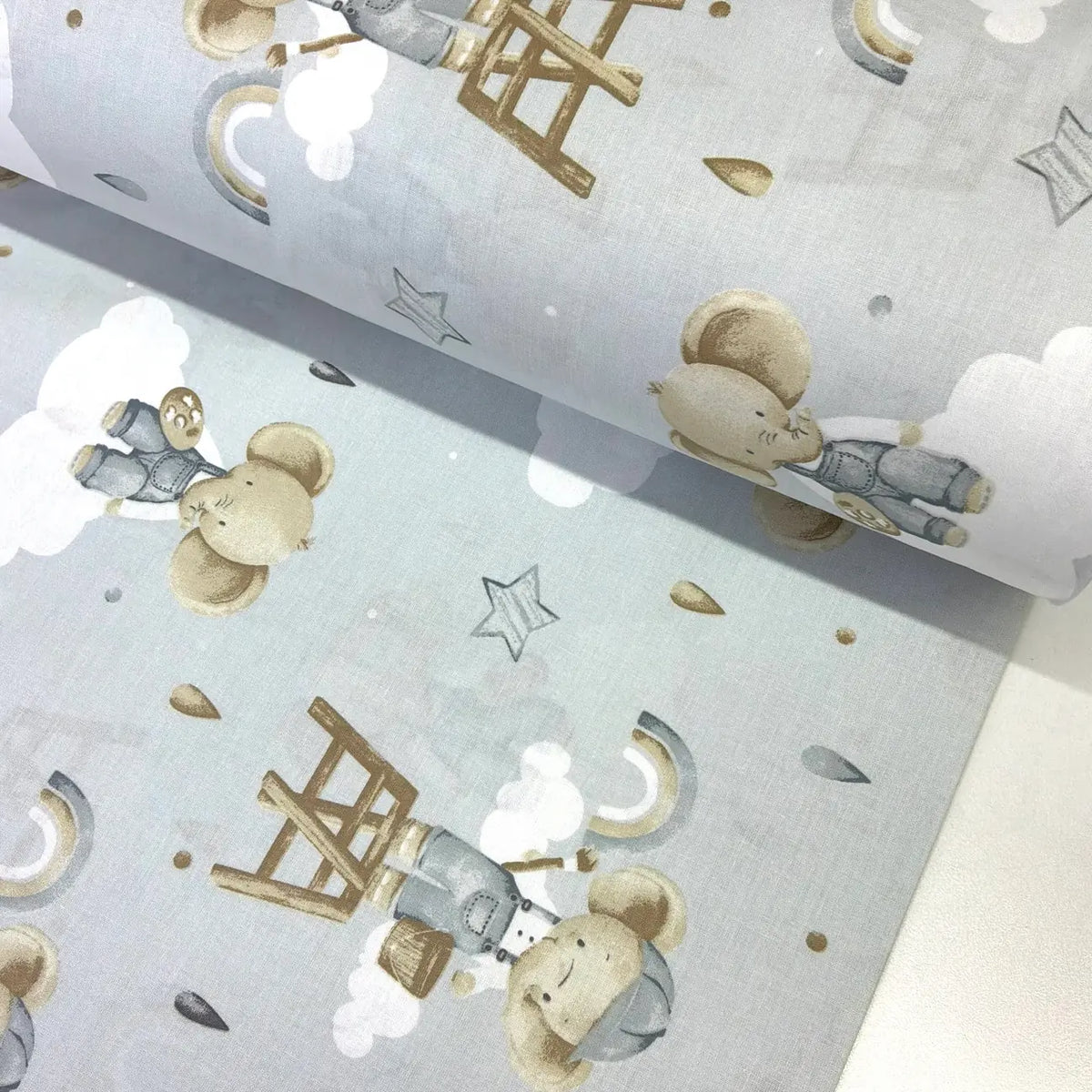 Blue cartoon elephant 100% cotton poplin fabric featuring cute elephants, clouds, rainbows and stars.