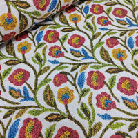 Colourful folk vine flower print upholstery curtain fabric.