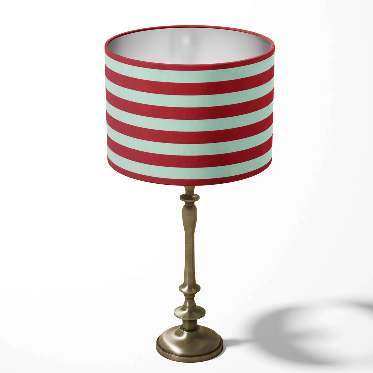 Red stripe table lampshade on a white background.
