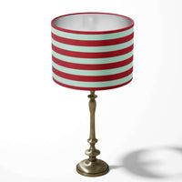 Red stripe table lampshade on a white background.