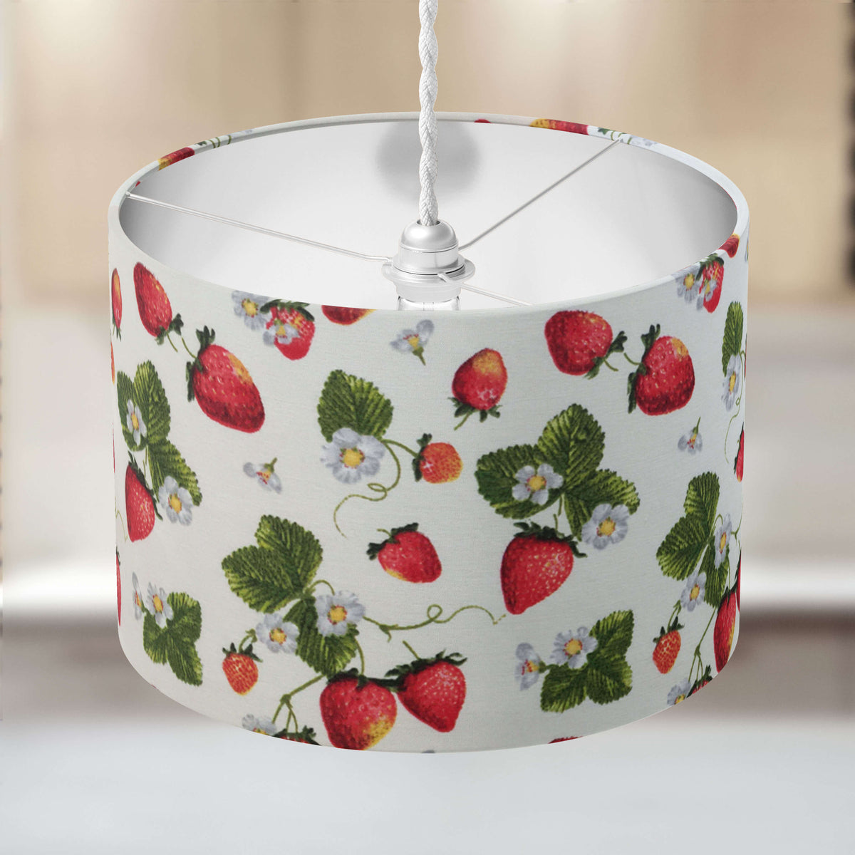 Lampshade with strawberry summer fruit pattern on a neutral background.