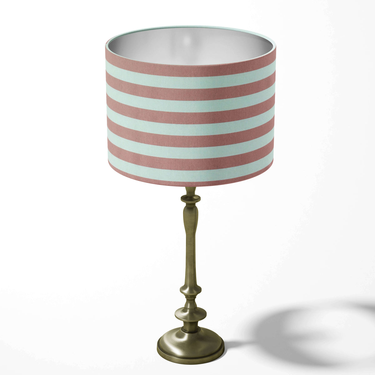 Dusty pink and white horizontal thin stripe table lampshade on a white background.