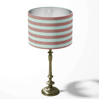 Dusty pink and white horizontal thin stripe table lampshade on a white background.