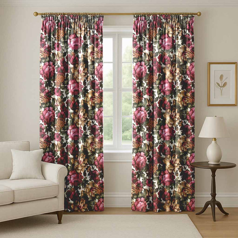 A pair of floor-length, pencil-pleat curtains with a dense, vintage floral pattern featuring large pink roses, golden-yellow blossoms, and dark green leaves hung on a gold curtain rod