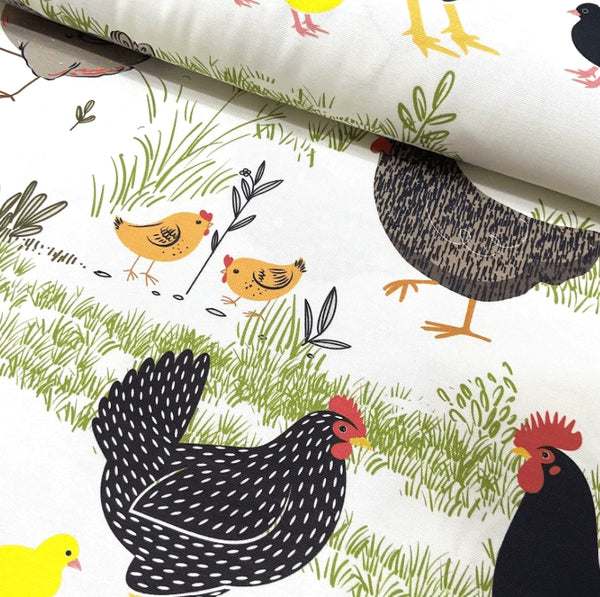 Black, yellow, orangge, green and white farm animal, chicken, rooster and chick patterned nursery room decor fabric.