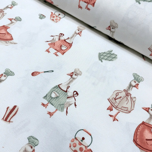 Fabric printed with farm animal goose in various outfits on a white background.
