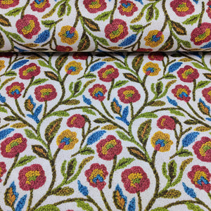 Floral tapestry upholstery fabric in burgundy, mustard, blue green and white.
