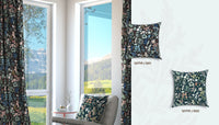 Green and black floral-patterned curtains and cushions in a room with a view of mountains.
