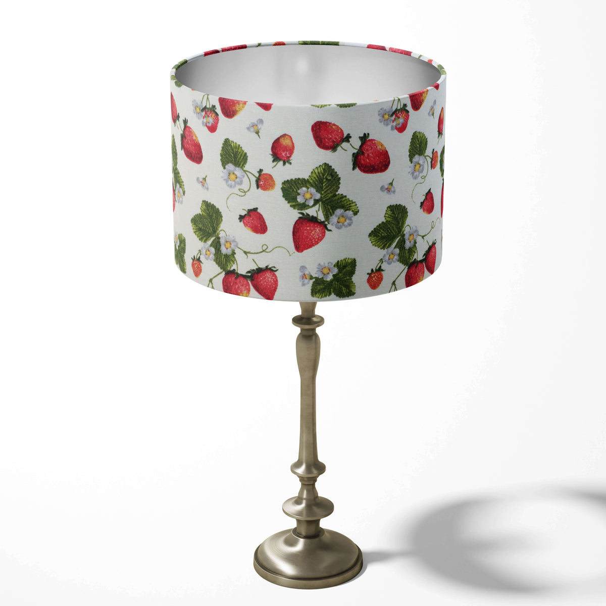 Table drum lampshade with a strawberry fruit pattern on a white background.