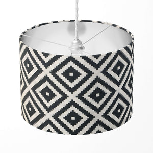 Lampshade with black and white geometric pattern on a white background.