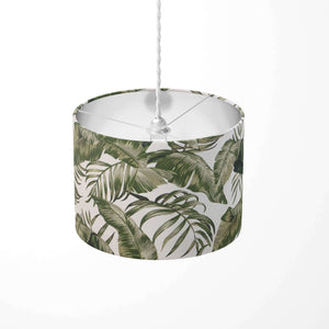 Pendant light shade with a green leaf pattern on a white background.