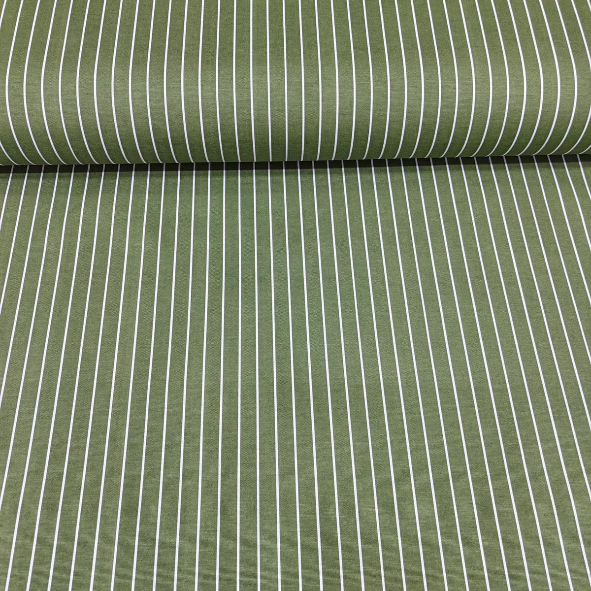 Roll of green fabric with white pinstripes cotton canvas fabric