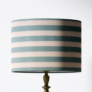 Horizontal striped lampshade with duck egg and white stripes on a white background.