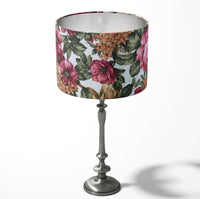 Table drum lampshade with burgundy floral pattern on a white background.